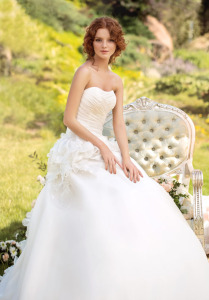 Style #1418, strapless organza ball gown wedding dress with beaded floral details, available in cream