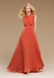 Style #0807, floor-length A-line sleeveless chiffon gown with a button up collar top with lace underlining and chiffon ruffles, available in turquoise, orange and black