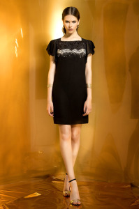 Style #932, sheath style cocktail dress with short sleeves and black and white embellishment on the top, available in black