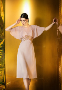 Style #931, knee-length cocktail dress with chiffon bat sleeves, open V-back and gold embroidery on the top, available in powder, dark cream, black