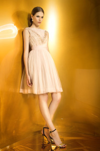 Style #933, short pleated tulle dress with lace embroidery and buttons on the bodice, available in pale pink, ivory and black