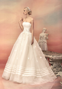 Style #1517, strapless ball gown wedding dress with floral applique details, available in white and ivory