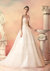Style #1533L, tulle ball gown with tiered skirt and floral appliques, available in white, ivory and pink