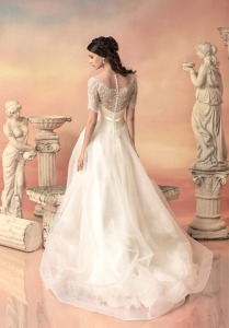 Style #1535, a-line wedding dress with lace bodice and sleeves, available in white and ivory