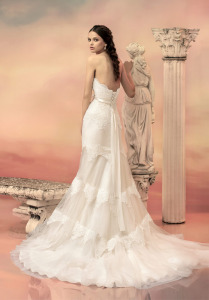 Style #1536L, fit and flare wedding dress with tired lace appliques, available in light ivory