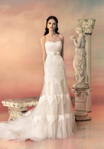 Style #1536L, fit and flare wedding dress with tired lace appliques, available in light ivory