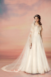 Style #1559, a-line wedding dress with lace bodice and sleeves, available in white and ivory