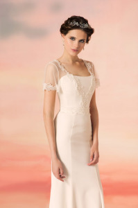 Style #1564L, sheath wedding dress with lace trimmed sleeves and plunging neckline, available in white and ivory