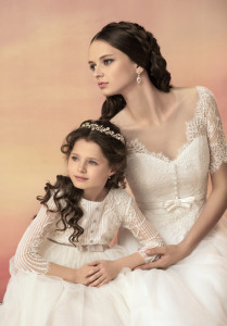 Style #1535, a-line wedding dress with lace bodice and sleeves, available in white and ivory