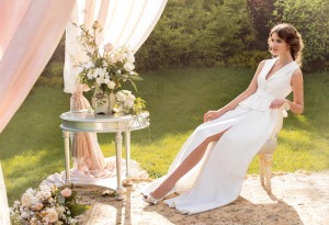 Style #1428, fitted wedding gown with front slit and plunging neckline, available in ivory
