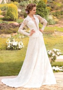 Style #1444, long sleeve lace wedding gown with plunging neckline, available in white and ivory