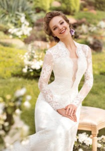 Style #1444, long sleeve lace wedding gown with plunging neckline, available in white and ivory