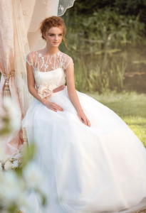 Style #1450, a-line tulle wedding gown with lace bodice and floral belt, available in ivory