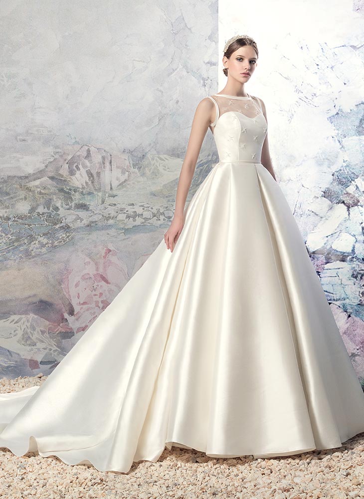 Style #1605L, Mikado ball gown wedding dress with pleated skirt and illusion neckline, available in white and ivory
