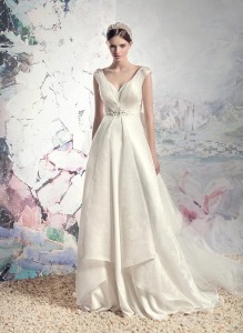 Style #1610, plunging neckline jacquard a-line wedding dress with beaded belt and train, available in cream