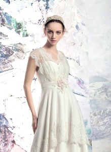 Style #1613L, vintage-inspired sheath wedding dress with lace details, available in white and ivory