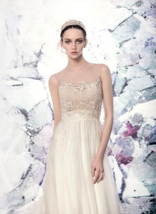 Style #1614L, tulle A-line wedding dress with beaded bodice and illusion neckline, available in ivory