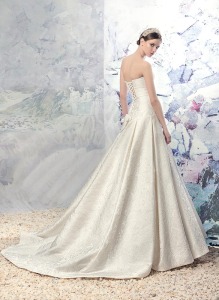 Style #1625L, jacquard a-line wedding gown with pleated skirt and beaded belt, available in ivory