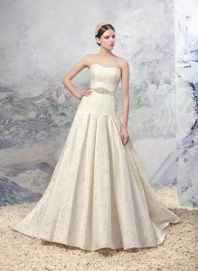 Style #1625L, jacquard a-line wedding gown with pleated skirt and beaded belt, available in ivory