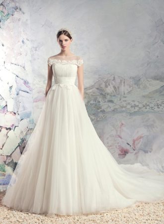 Style #1631L, tulle ball gown wedding dress with pleated bodice and lace accents, available in ivory