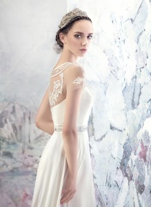 Style #1634L, A-line wedding gown with embroidered illusion neckline, available in ivory