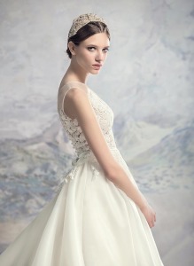 Style #1638L, a-line wedding dress with organza skirt and beaded lace bodice, available in cream