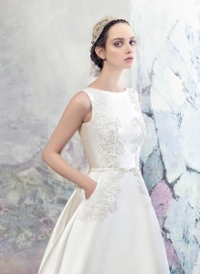 Style #1643L Premium, taffeta A-line wedding dress with side pockets and lace embroidery, available in ivory