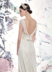 Style #1652LS, lace sheath wedding gown with cap sleeves and plunging back, available in ivory
