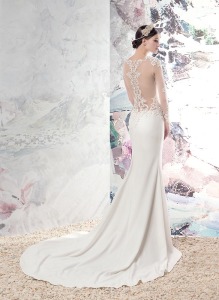Style #1670L, fitted wedding gown with plunging neckline, illusion long sleeves and cutouts on sides, low back, and lace appliques, available in ivory