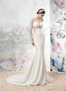 Style #1670L, fitted wedding gown with plunging neckline, illusion long sleeves and cutouts on sides, low back, and lace appliques, available in ivory