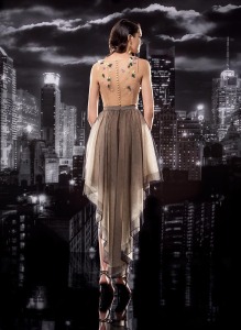 Style #129, yellow and lilac 3D flower on top of a nude crop tank top and high low pleated black skirt, skirt available in black; blouse available in nude
