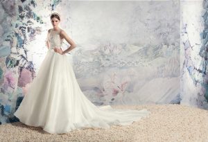 Style #1638L, a-line wedding dress with organza skirt and beaded lace bodice, available in cream