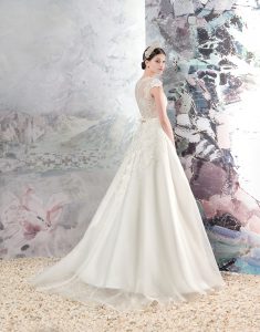Style #1658, organza a-line wedding dress with lace bodice and cap sleeves, available in cream
