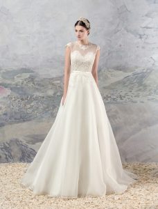 Style #1658, organza a-line wedding dress with lace bodice and cap sleeves, available in cream