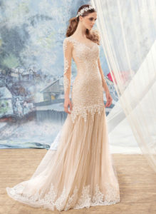 Style #1704L, beaded lace fit and flare wedding dress with an illusion neckline and long sleeves, available in nude (photo), ivory