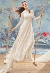 Style #1705L, long sleeve A-line wedding gown with lace appliques and embroidery, available in ivory