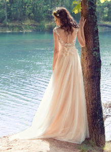 Style #1746L, illusion neckline A-line wedding dress with cap sleeves and pearl buttons down the back, available in white, nude-ivory (photo)