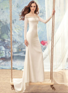 Style #1712L, fitted wedding dress with off the shoulder long sleeves, available in ivory