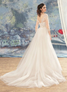 Style #1715, beaded lace sheath wedding dress with illusion 3/4 length sleeves and detachable tulle train, available in ivory