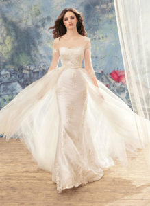 Style #1715, beaded lace sheath wedding dress with illusion 3/4 length sleeves and detachable tulle train, available in ivory
