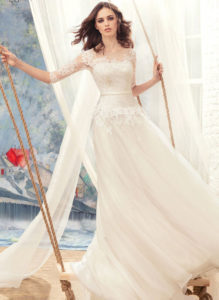 Style #1716L, tulle A-line wedding gown with illusion lace sleeves and beaded bodice, available in white-ivory