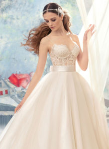 Style #1723L, beaded lace bustier bodice ball gown wedding dress with tulle skirt and satin bow belt, available in ivory (with ivory cup - photo), ivory (with nude cup)
