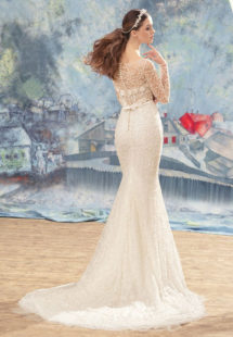 Style #1727L, beaded lace fit and flare wedding gown with sheer bodice and long sleeves, available in ivory