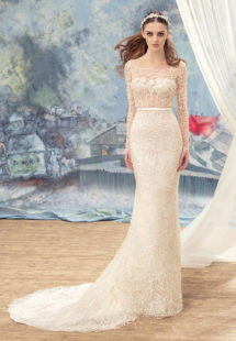 Style #1727L, beaded lace fit and flare wedding gown with sheer bodice and long sleeves, available in ivory