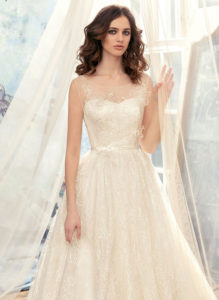 Style #1729L, tulle ball gown wedding dress with illusion neckline and lace appliques, available in cream