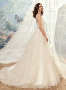 Style #1729L, tulle ball gown wedding dress with illusion neckline and lace appliques, available in cream