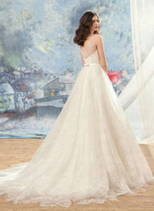 Style #1729L, tulle ball gown wedding dress with illusion neckline and lace appliques, available in cream