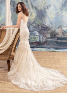 Style #1732L, mermaid wedding dress with tiered lace skirt and cap sleeves, available in ivory