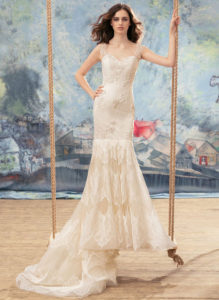 Style #1732L, mermaid wedding dress with tiered lace skirt and cap sleeves, available in ivory