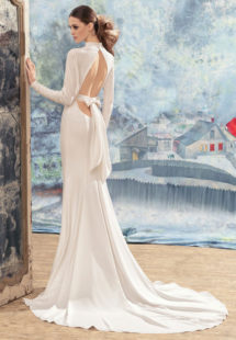 Style #1733La, open back sheath wedding dress with crystals on the high neckline, long sleeves and bow back belt, available in ivory